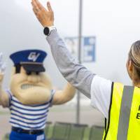 Louie the Laker and a staff volunteer dancing